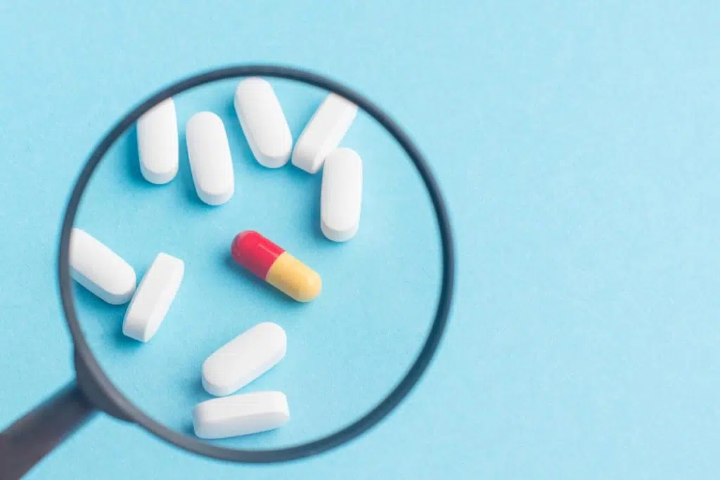 doctor examines drugs for adulteration or cross-contamination