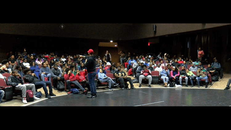 59d5f0d0-9582-4ea3-8669-c8828b9ee72e_750x422 man speaks to a crowd