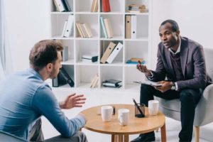 man talking with therapist at the men's rehab center in oh