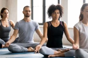 men and women doing yoga at the addiction recovery center location in ohio