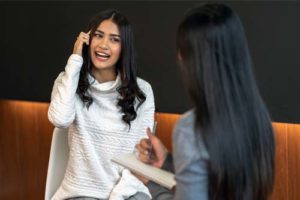 woman fidgeting with hair during individual therapy at the Women’s Rehab Centers in oh