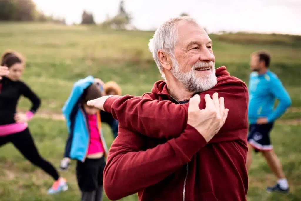 senior man stretching before a jog to strengthen Coping Skills