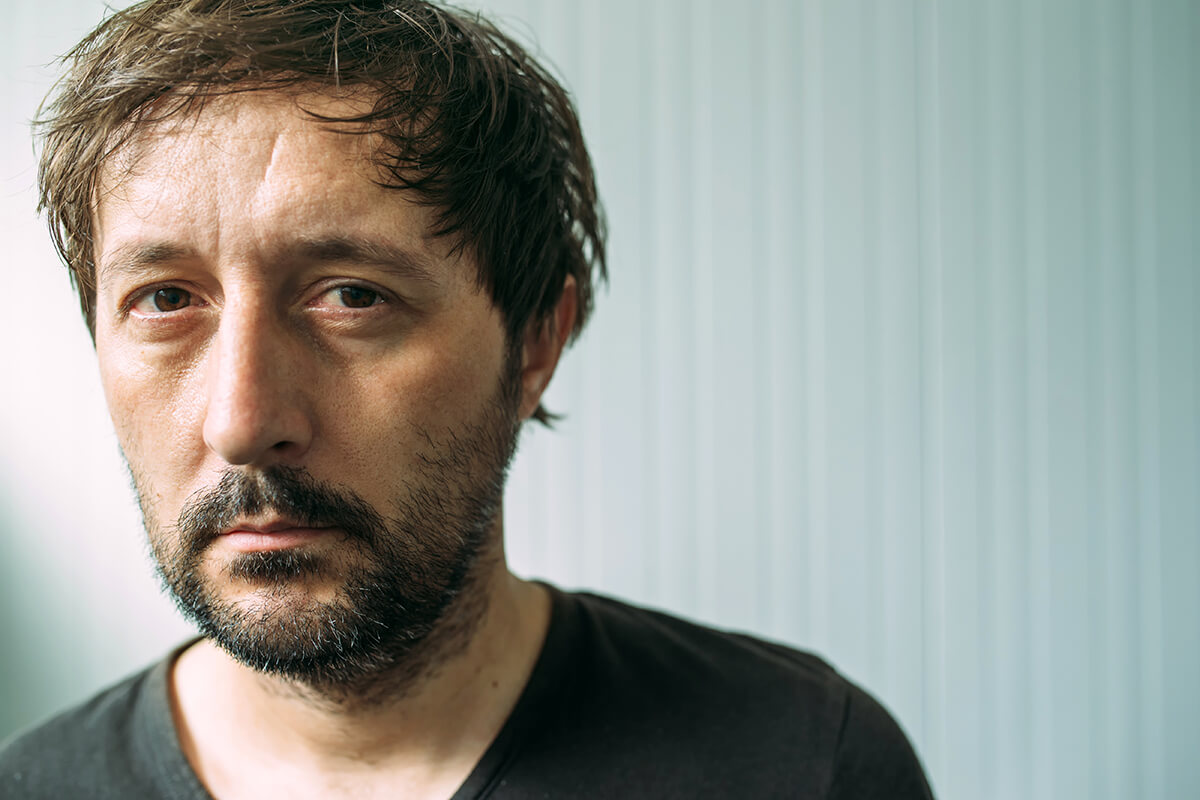 ragged man worried about Drug Overdose Symptoms