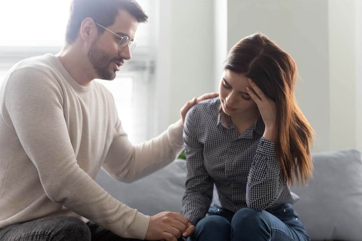 man helping downtrodden wife Stop Addictive Behaviors