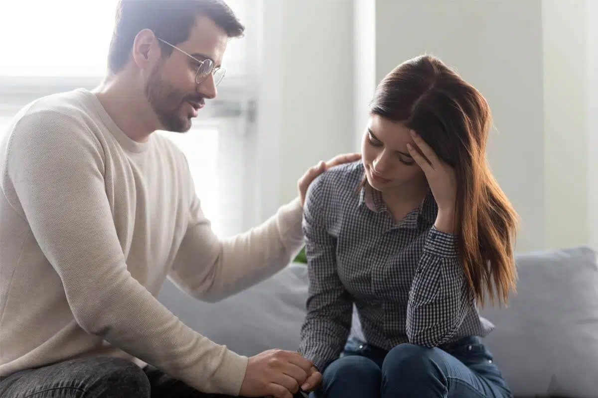 man helping downtrodden wife Stop Addictive Behaviors