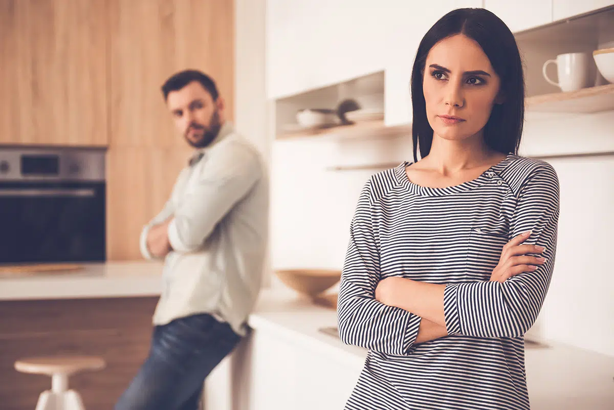wife turned away from husband showing alcohol's effects on family