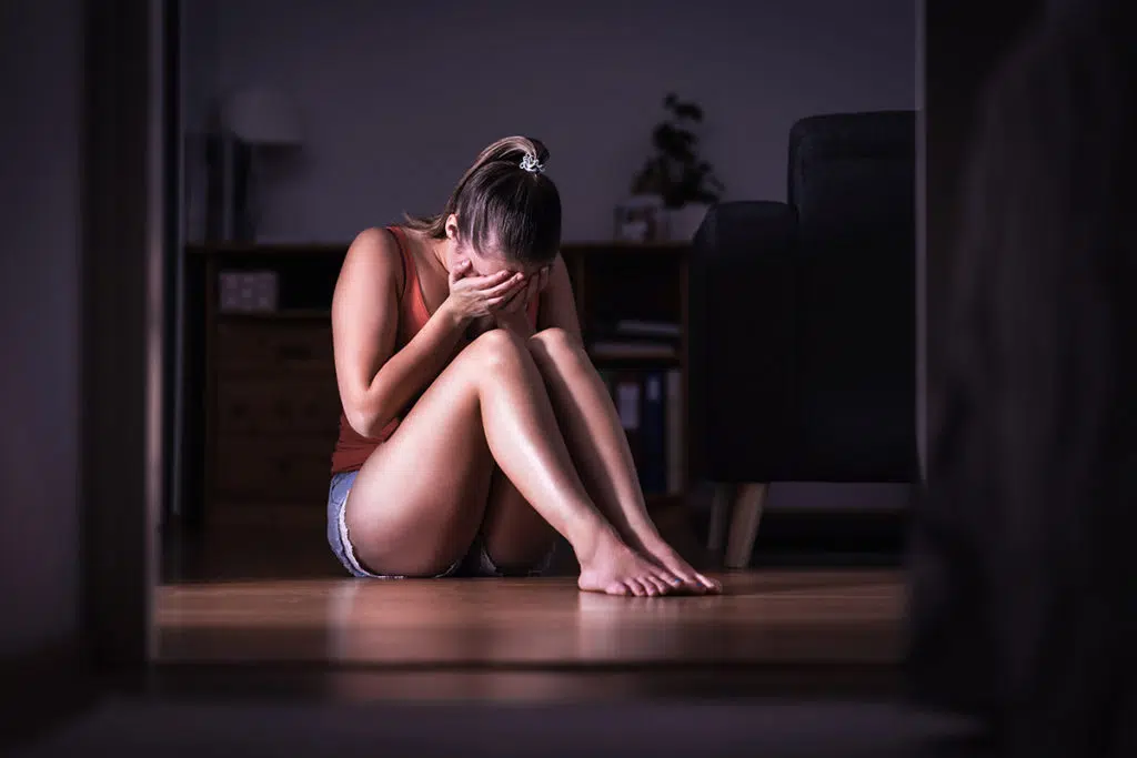woman suffering from childhood trauma and addiction