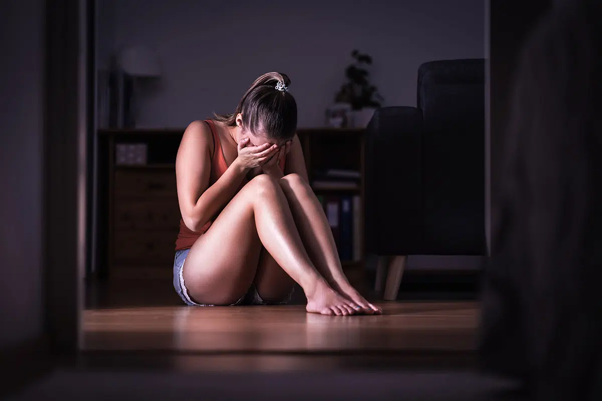 woman suffering from childhood trauma and addiction