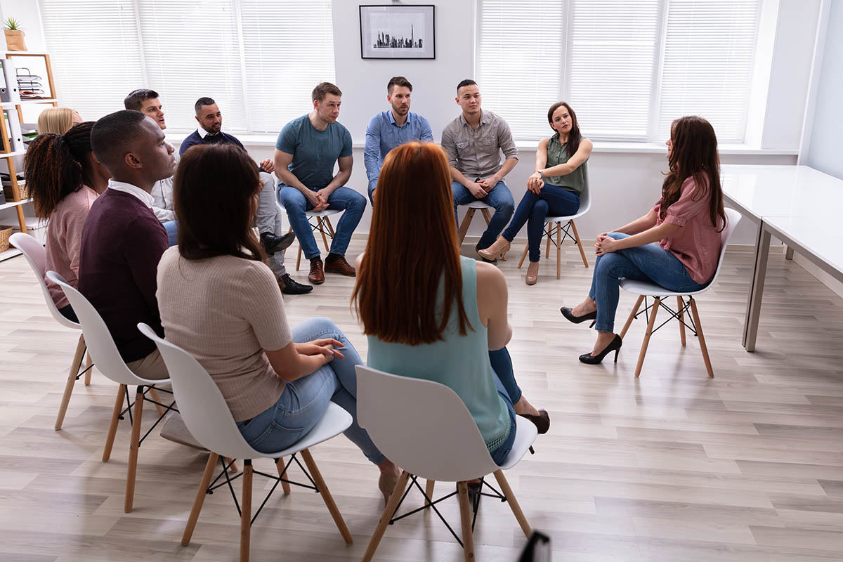 Group discusses different types of addiction treatment therapy