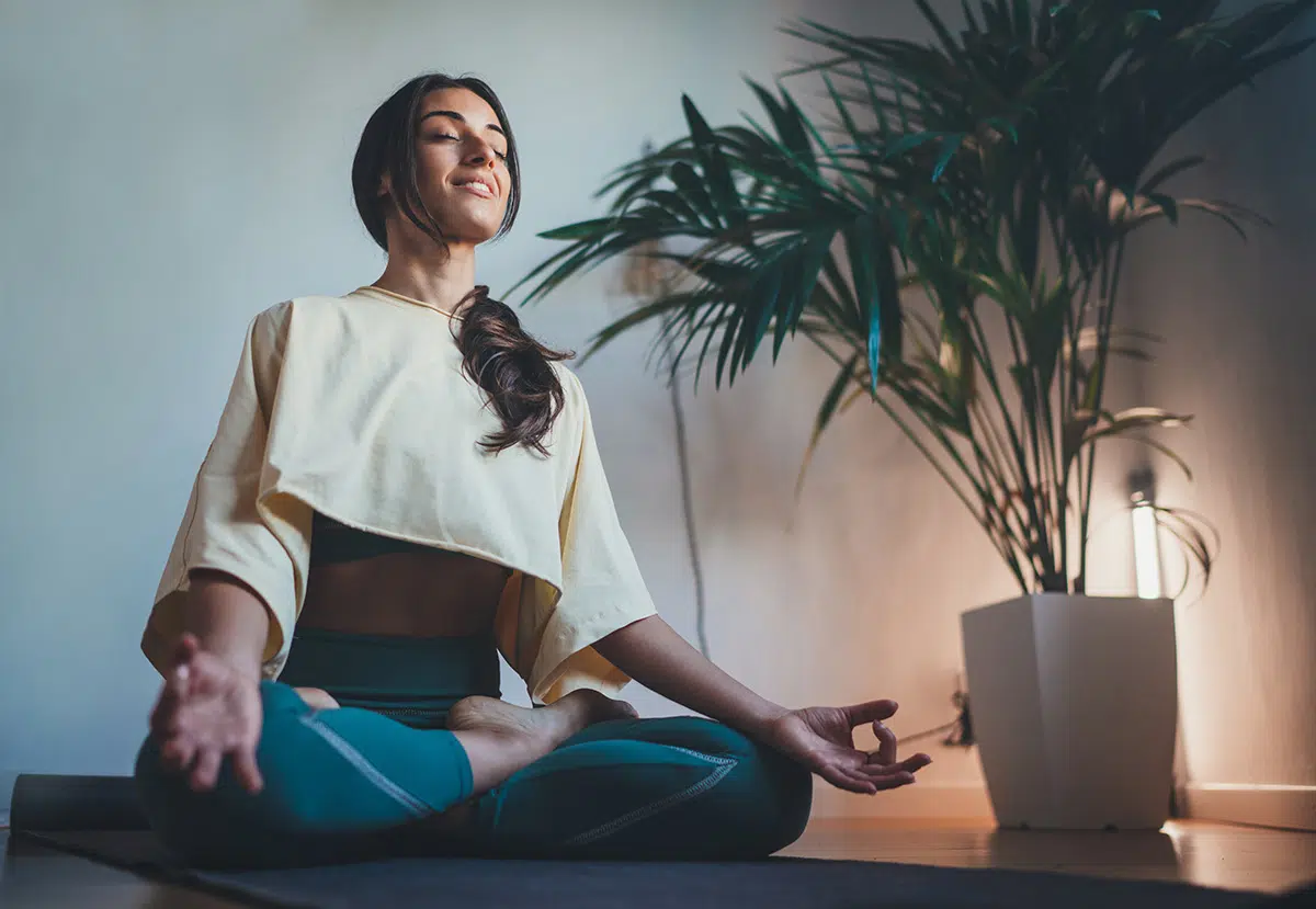 woman meditates during recovery