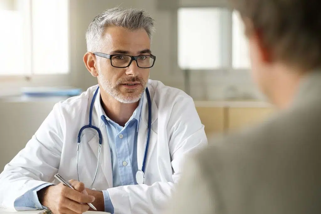 doctor explains the benefits of a partial hospitalization center