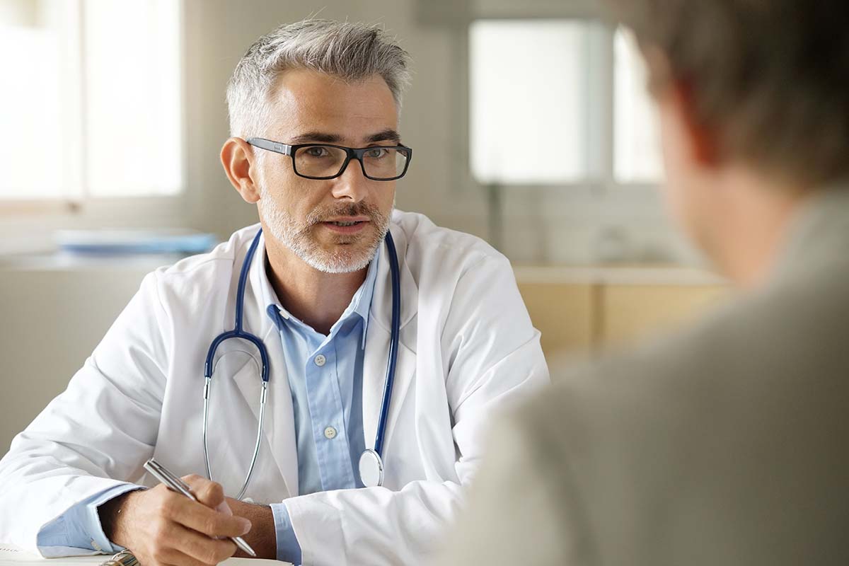 doctor explains the benefits of a partial hospitalization center