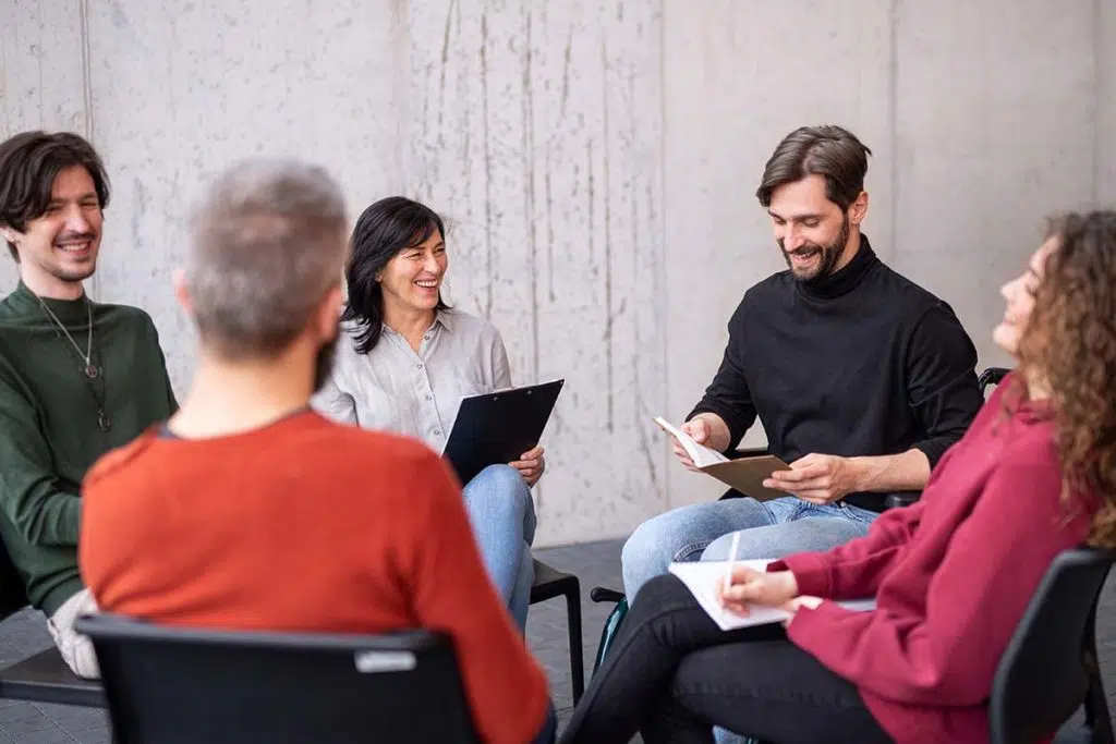 people experiencing the benefits of group therapy