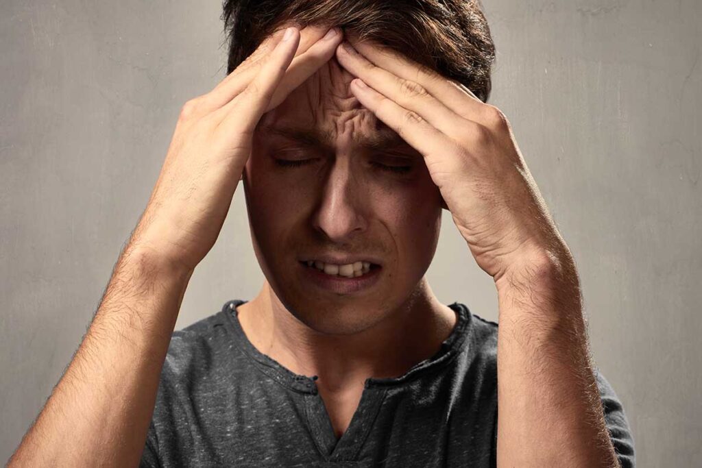 individual experiencing physical effects of heroin addiction